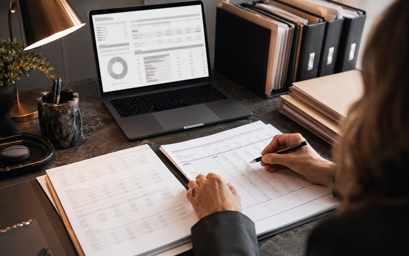 Trust account records and law firm workflow materials being reviewed in a professional office